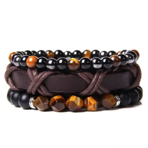 Gothic Mehrstrang Lederarmband mit Natursteinen, Tiger Eye und schwarzem Onyx, geflochtenes Leder mit silbernen Metallakzenten, Nahaufnahme Studio-Ansicht auf weißem Hintergrund