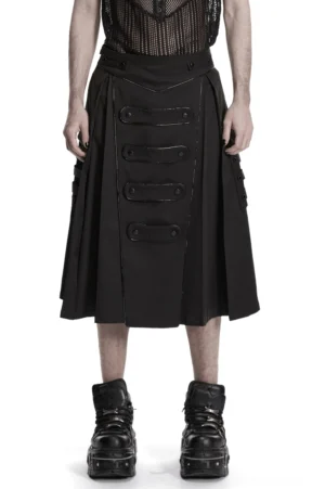 Schwarzer Gothic Utility Herrenrock mit Cargo-Taschen und vorderen Riemenpanelen – Frontansicht auf männlichem Modell in Studio-Setting mit Netzoberteil und Plateau-Stiefeln