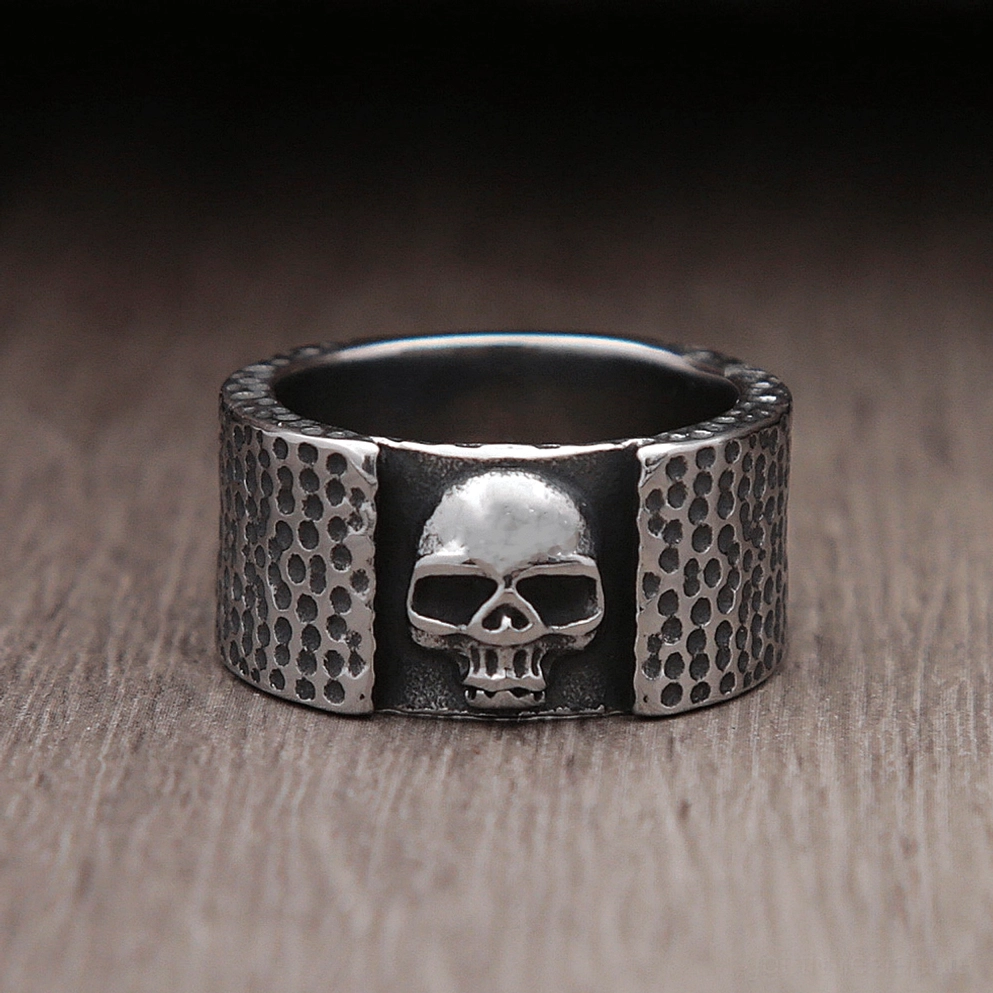 Frontal skull biker ring front view showcasing vintage dark silver finish and bold embossed design skull face details