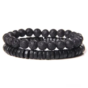 Vulkanisches Lavasteinarmband in Schwarz mit strukturierter poröser Oberflächenstruktur und matter Spacer-Verzierung, robustes Gothic Schmuckstück für Alternative Fashion und Industrial-Ästhetik